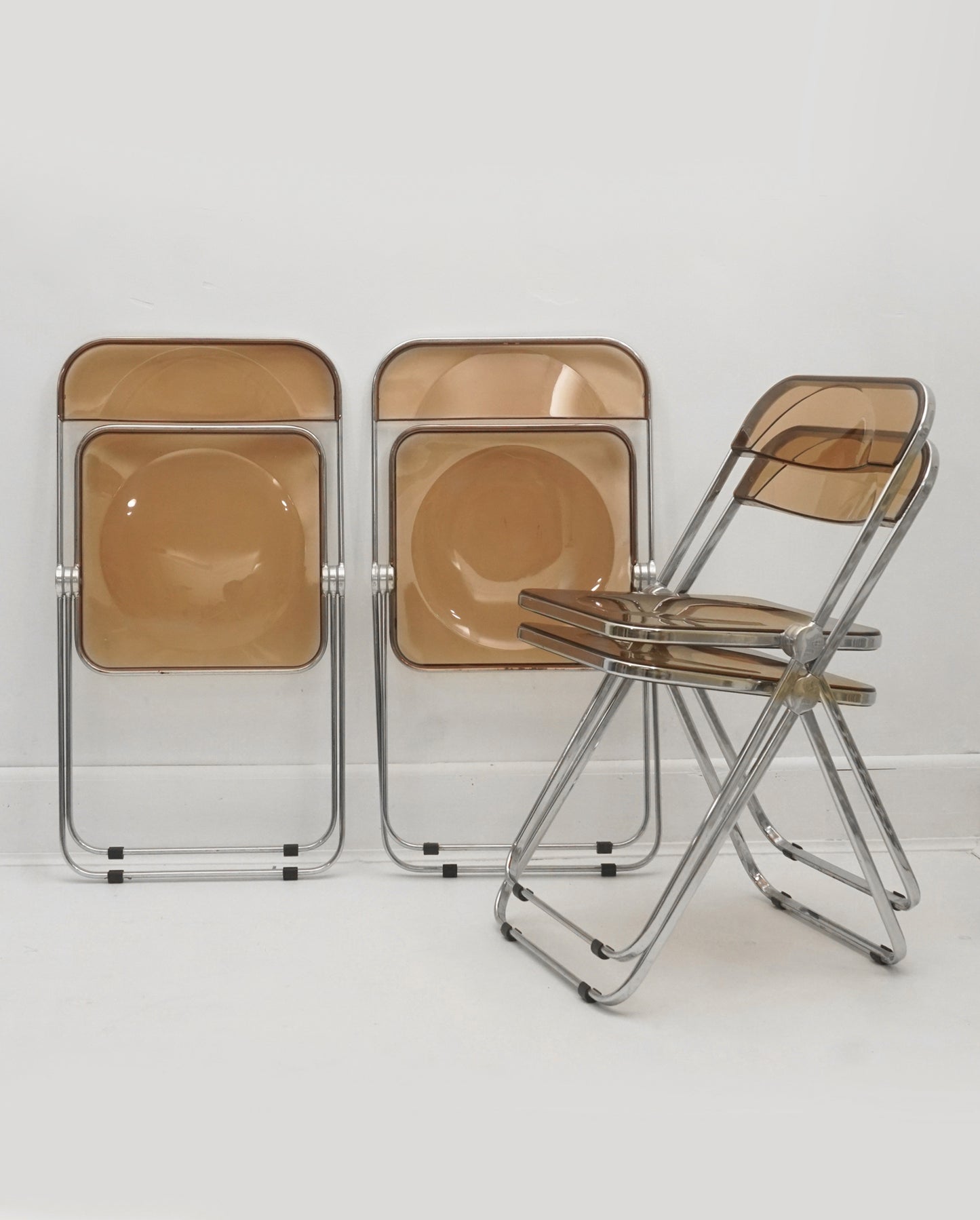 1960s Italian “Plia” Smoked Bronze Lucite Folding Chairs by Giancarlo Piretti for Anonima Castelli